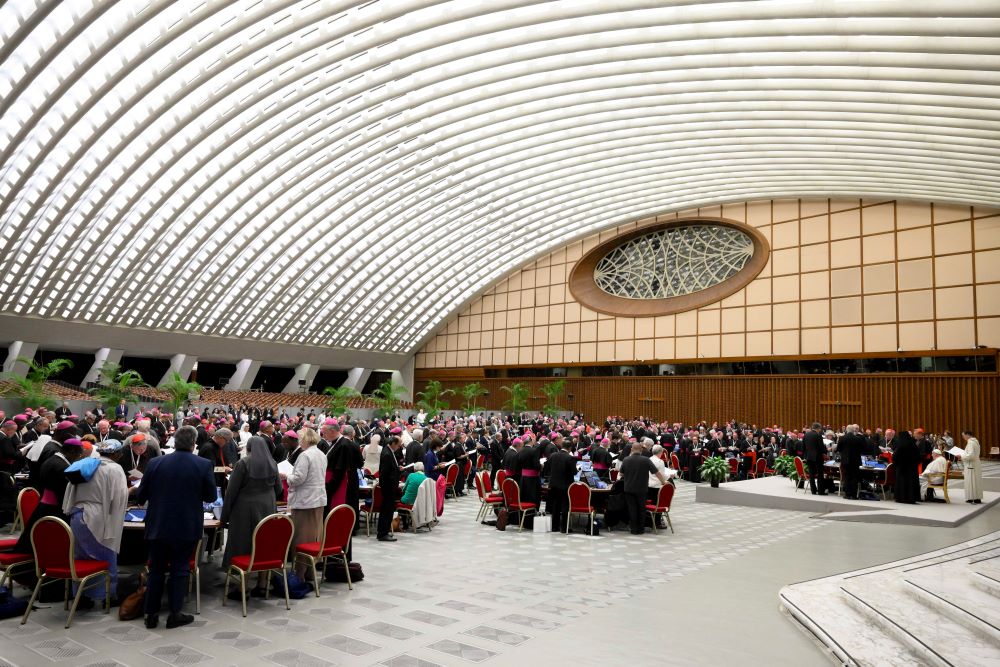 Pope Francis and members of the Synod of Bishops on synodality offer a prayer of thanks to God after the synod's final working session Oct. 26 in the Paul VI Audience Hall at the Vatican. (CNS/Vatican Media)