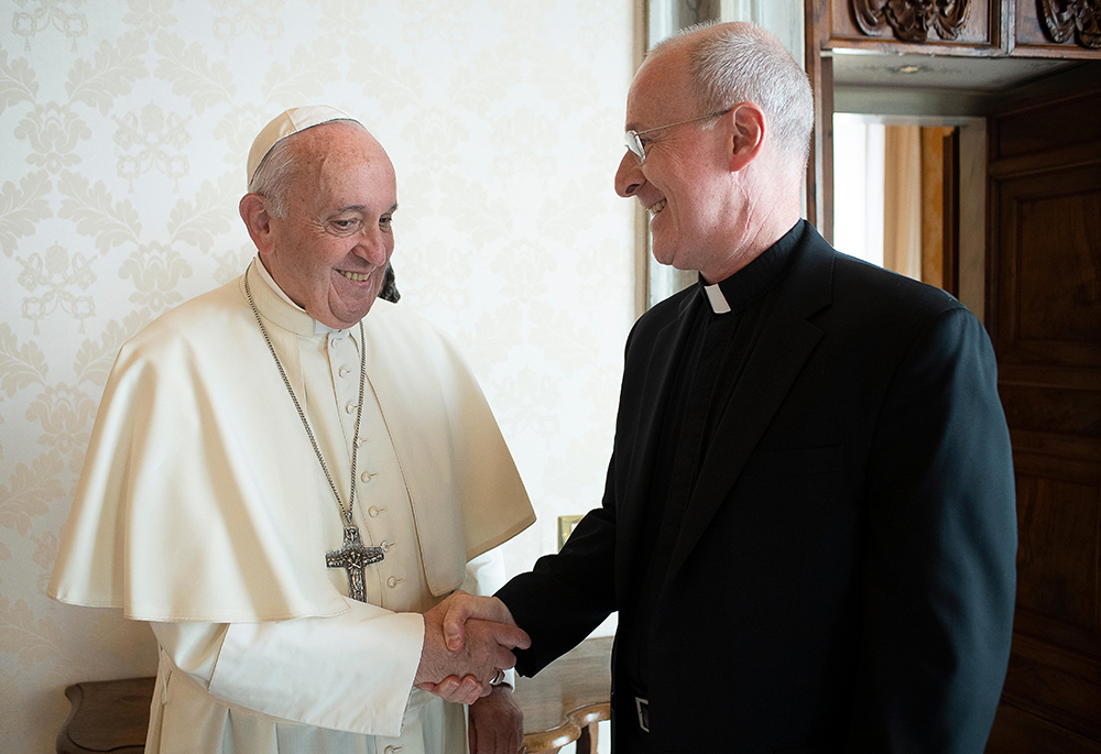 Pope Francis greets Jesuit Fr. James Martin, author and editor at large of America magazine, during a private meeting at the Vatican in this Oct. 1, 2019, file photo. Martin, a consultor to the Vatican Dicastery for Communication, ministers extensively to LGBTQ persons. (CNS/Vatican Media)