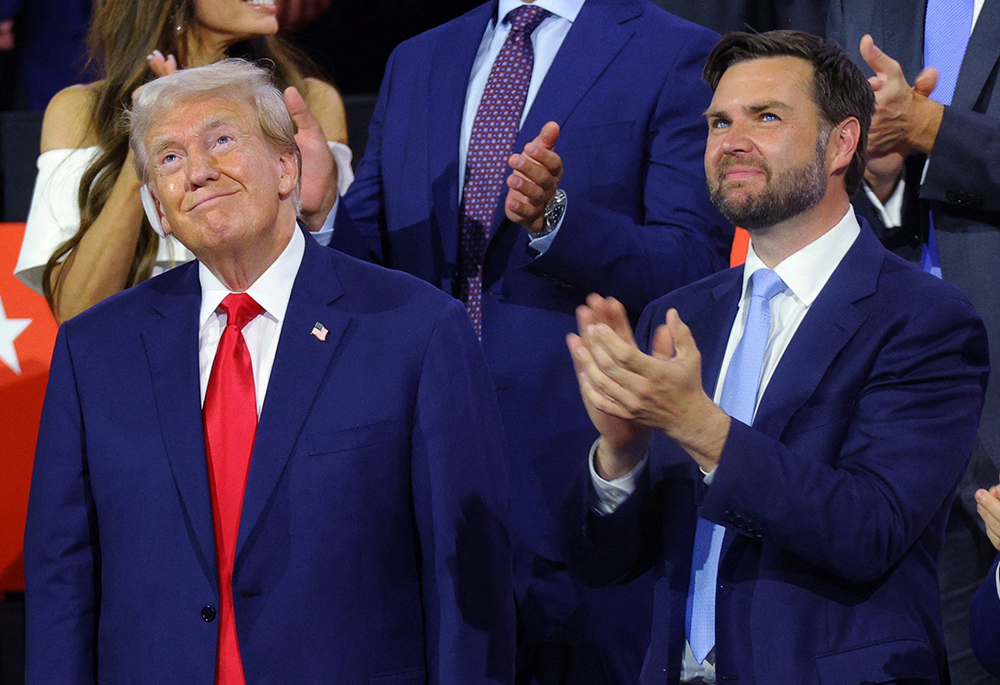 Republican presidential nominee and former President Donald Trump joins Republican vice presidential nominee Sen. JD Vance of Ohio during Day 1 of the Republican National Convention at the Fiserv Forum, July 15 in Milwaukee. (OSV News/Reuters/Brian Snyder)