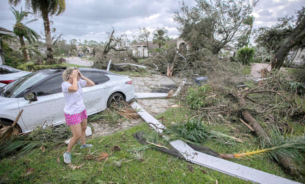 Marie Cook reacts to the damage to her home in Wellington, Fla., Oct. 10, 2024, after a tornado formed by Hurricane Milton touched down striking homes in the neighborhood and surrounding area. (OSV News photo/Bill Ingram/Palm Beach Post/USA Today Network via Reuters)