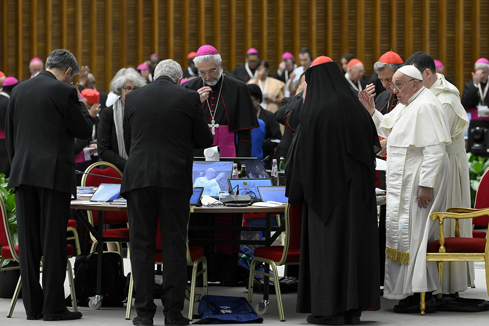 Pope Francis gives his blessing to members of the Synod of Bishops on synodality after the synod's final working session Oct. 26, 2024, in the Paul VI Audience Hall at the Vatican. (CNS/Vatican Media)