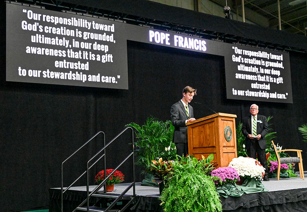 Siena College senior Timothy Nigro reads a letter from Pope Francis to the Franciscan school sent in support of its two-day symposium on integral ecology. (Courtesy of Siena College)