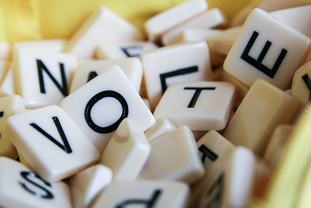 Jumbled letters spelling VOTE (Unsplash/Glen Carrie)