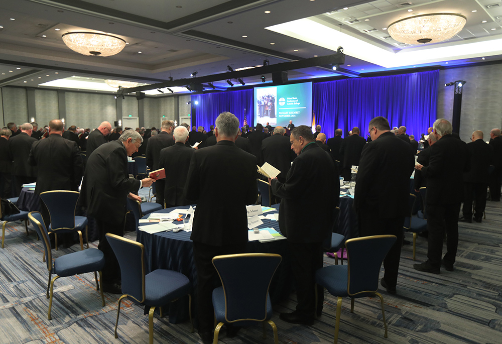 Prelates pray during a Nov. 12 session of the fall general assembly of the U.S. Conference of Catholic Bishops in Baltimore. (OSV News/Bob Roller)