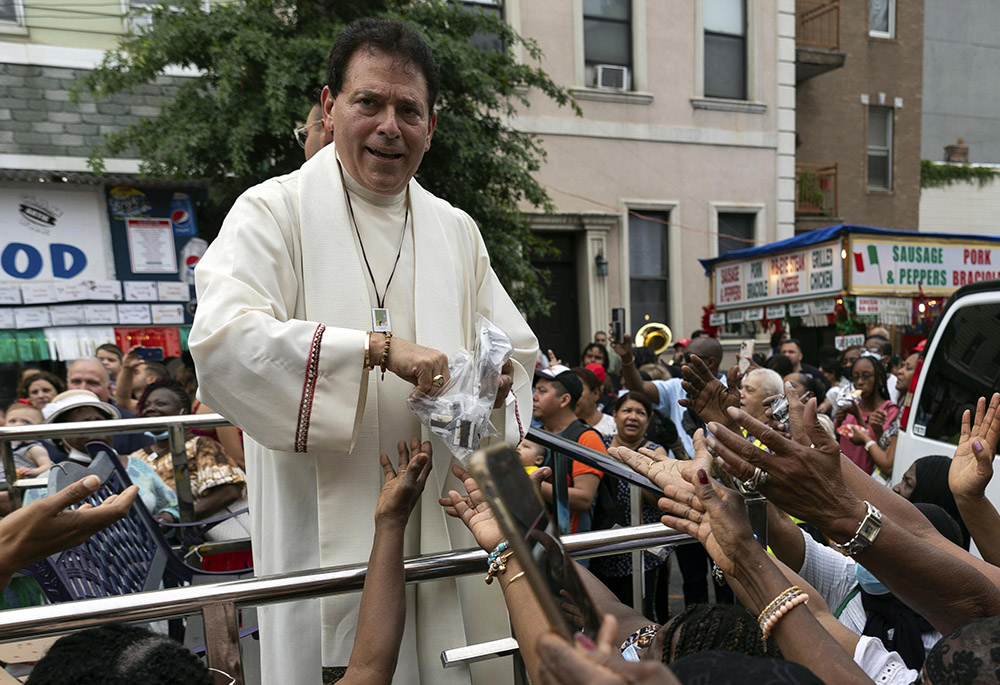 Msgr. Jamie Gigantiello, pastor of Our Lady of Mount Carmel-Annunciation Parish, speaks with parishioners, July 16, 2022, in the Brooklyn borough of New York. (AP photo/Julia Demaree Nikhinson, File)