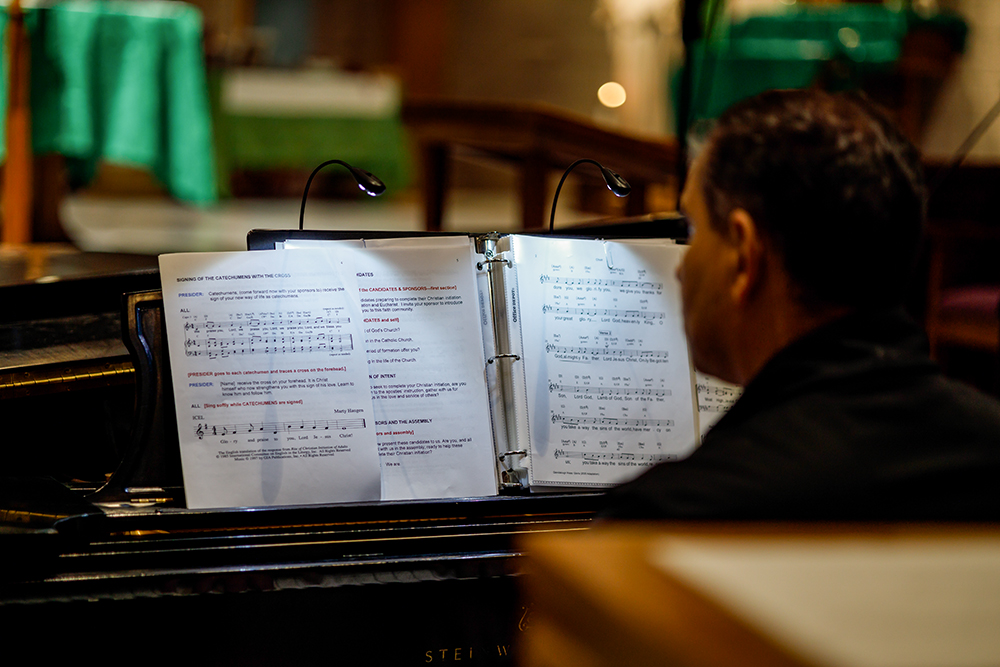 A pianist plays during evening Mass at the St. Thomas More Newman Center in Columbia, Missouri, on Nov. 3. (Artem Baidala)