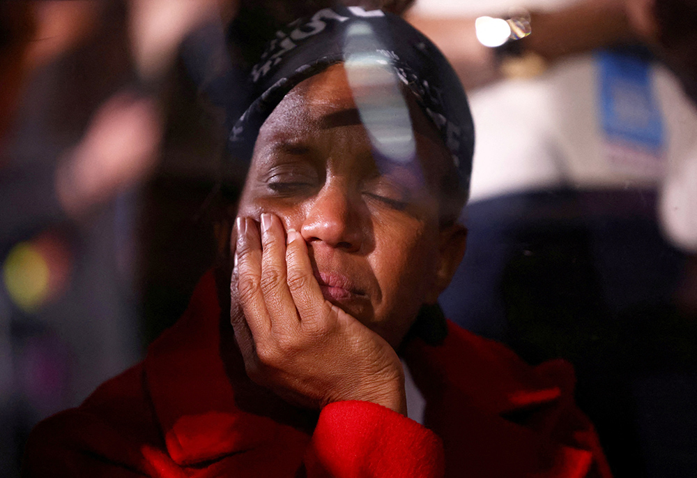 A supporter of Democratic presidential nominee U.S. Vice President Kamala Harris reacts to early election results at an Election Night rally at Howard University in Washington on Nov. 6. (OSV News/Reuters/Daniel Cole)