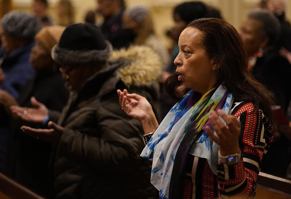 Worshippers recite the Lord's Prayer during a Black Catholic History Month Mass at the Basilica of St. Patrick's Old Cathedral in New York City Nov. 18, 2023. The liturgy was co-sponsored by the Archdiocese of New York and the Diocese of Brooklyn, New York. (OSV News/Gregory A. Shemitz)