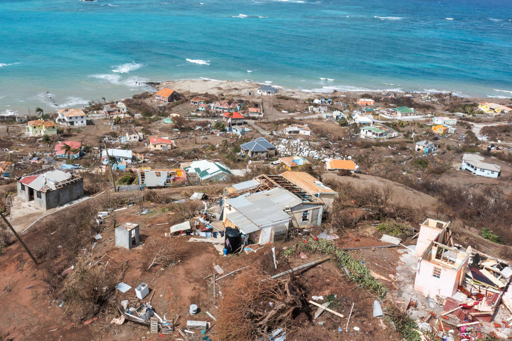 Scattered debris and houses with missing roofs are seen in a drone photograph July 2, 2024, after Hurricane Beryl passed the island of Petite Martinique, Grenada. (OSV News photo/Arthur Daniel, Reuters)