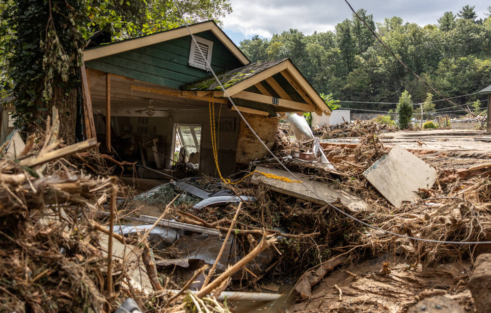 A destroyed house with a car under it in Chimney Rock, N.C., is seen Sept. 29, 2024, after the remnants of Hurricane Helene hit the town. The storm made landfall on Sept. 26 in Florida's Big Bend region as a Category 4 hurricane and was downgraded to a tropical storm the next morning. (OSV News photo/Khadejeh Nikouyeh, The Charlotte Observer handout via Reuters)