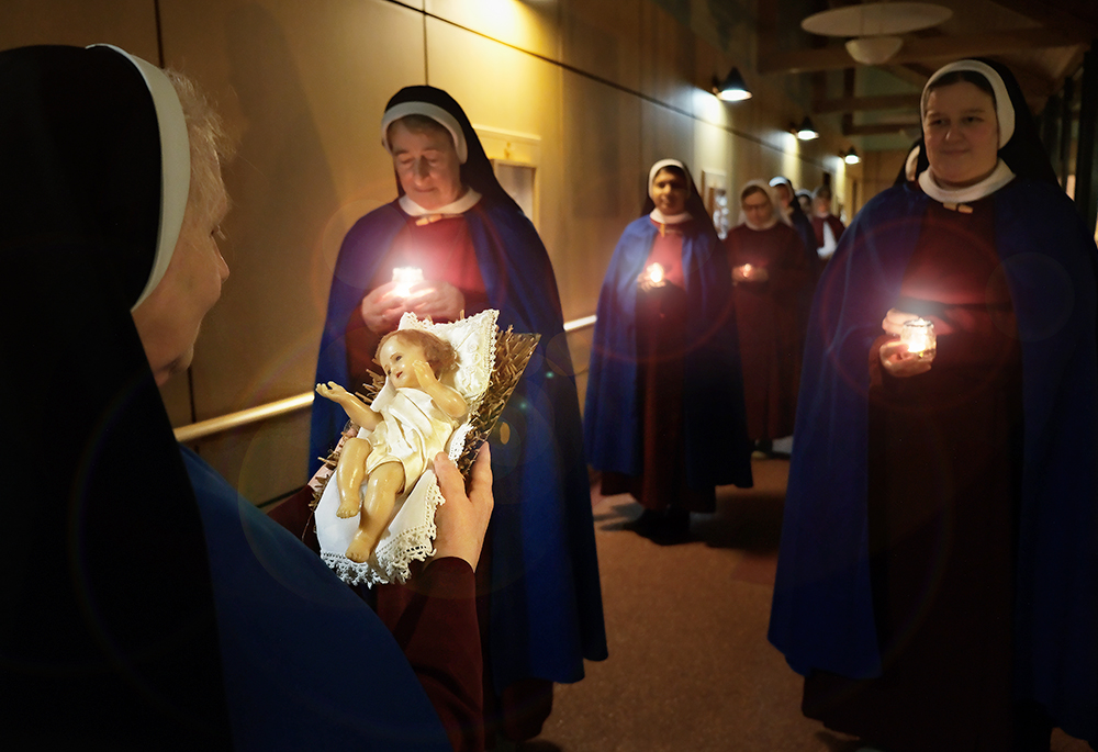 On Christmas Eve a candlelight procession carries the Child Jesus through every corner of the Sisters of the Most Holy Redeemer in Dublin, Ireland, where he is reverently welcomed with a kiss — a moving preparation for the Christmas vigil. (Courtesy of Angela Cameron)