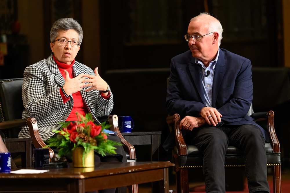 The New York Times columnist and Sr. Teresa Maya of the Congregation of the Sisters of Charity of the Incarnate Word in San Antonio, during the Dec. 10 public dialogue hosted by the Initiative on Catholic Social Thought and Public Life at Georgetown University in Washington, D.C. (Courtesy of Georgetown University/Rafael Suanes)