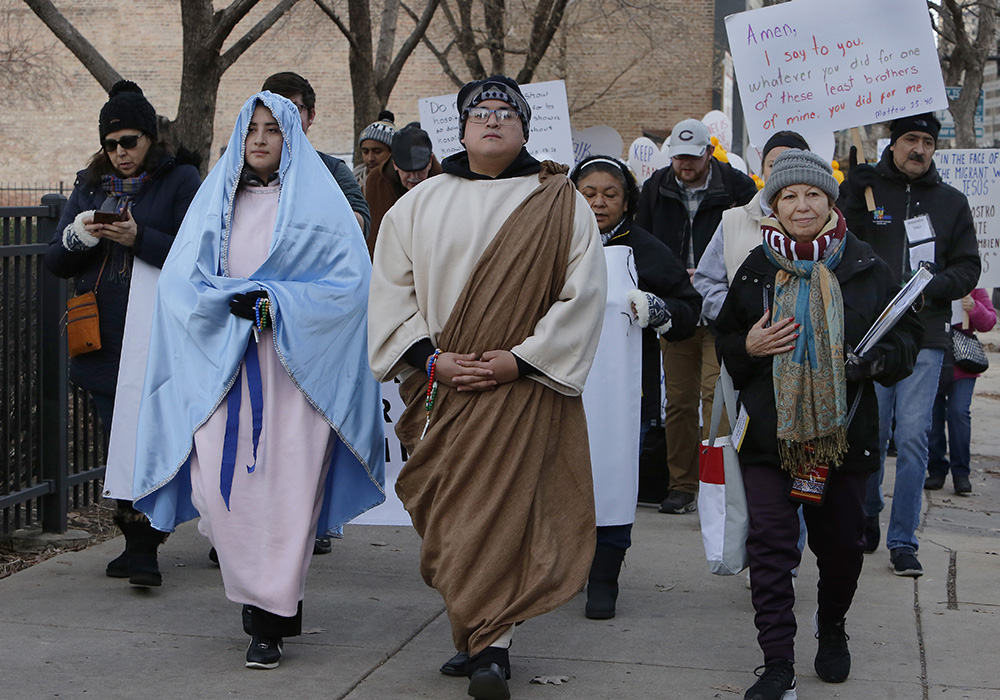 Participants joined the 19th Annual Posada Seeking Immigration Reform, organized by the Archdiocese of Chicago's Office of Human Dignity and Solidarity-Immigration Ministry, on Dec. 13. The one-mile procession began at the U.S. Citizenship and Immigration Services Center in Chicago, stopping at key locations before concluding at Old St. Patrick's Church. Pictured are participants of the event in 2023. (Courtesy of the Archdiocese of Chicago)