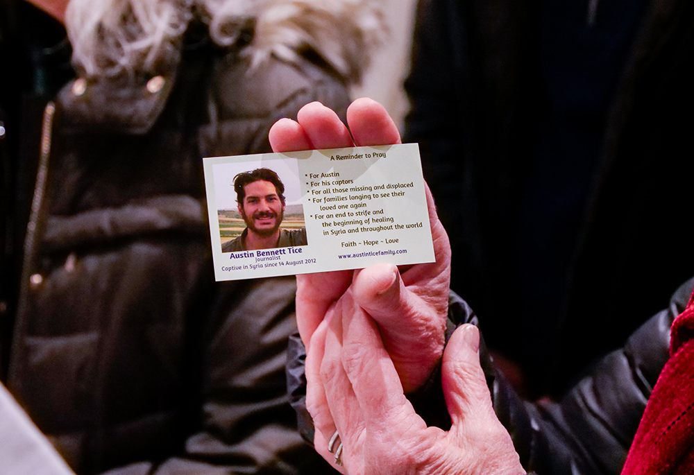 A magnet displays a picture of Debra Tice's son Austin. Austin Tice disappeared in 2012 while freelance reporting on the Syrian civil war. (NCR photo/Anthony Peltier)