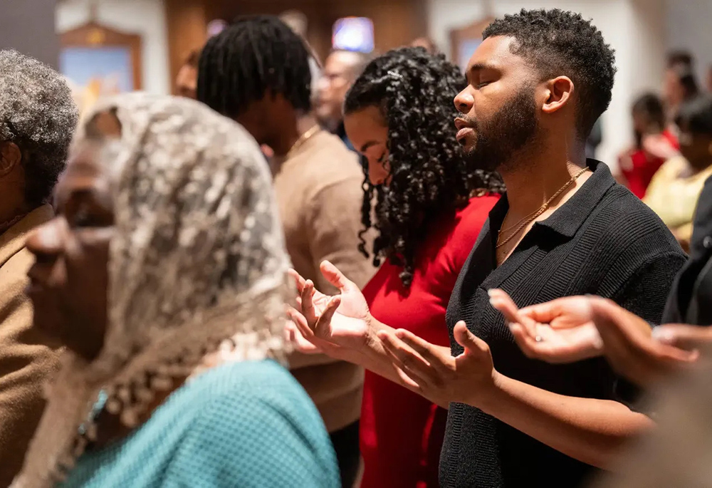 Worshippers pray during a Black Catholic History Month Mass in November at the Cathedral of St. Thomas More in Arlington, Virginia. (BCM/Catholic Herald/Jim Hale)