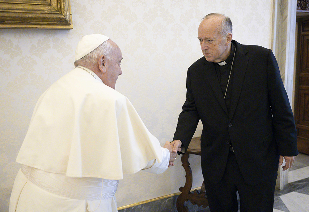 Pope Francis greets Cardinal Robert McElroy of San Diego in the library of the Apostolic Palace at the Vatican on Oct. 10, 2024. (CNS/Vatican Media)