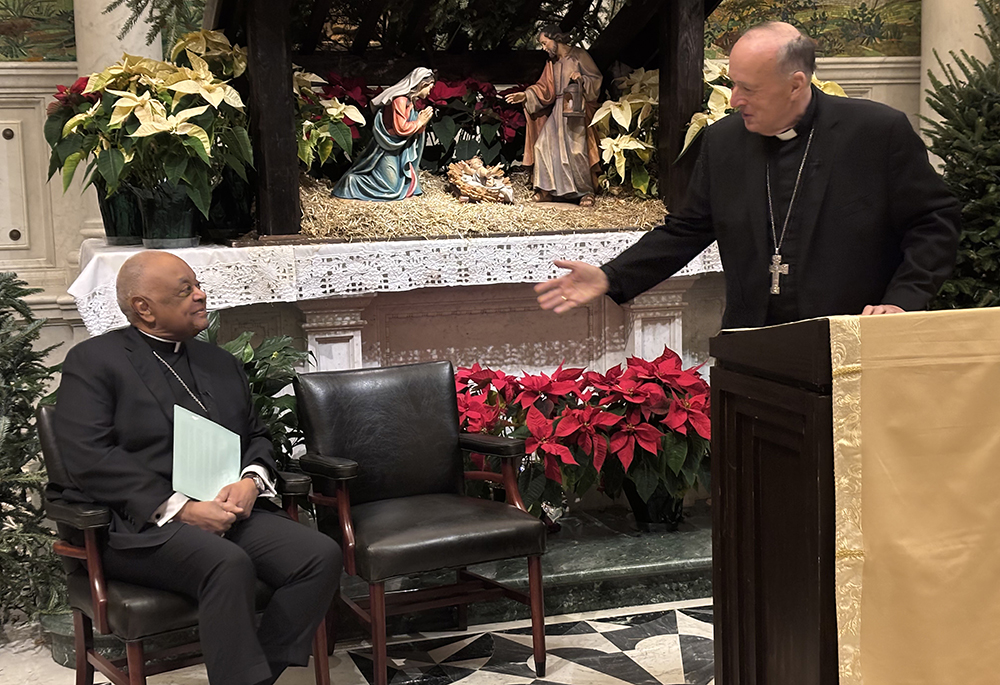 Cardinal Robert McElroy greets Cardinal Wilton Gregory during a press conference Jan. 6 at St. Matthew's Cathedral in Washington, D.C., announcing McElroy's appointment to the Washington Archdiocese. (NCR photo/James Grimaldi)