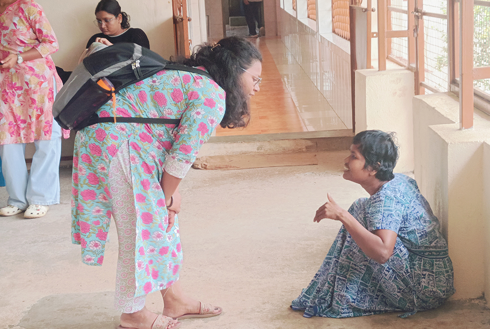 On a visit to a charity home, one of the volunteers strikes a conversation with one of the residents. (Tessy Jacob)