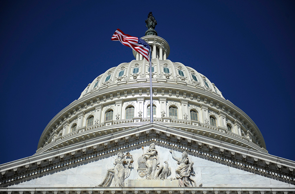 A file photo shows the American flag below the U.S. Capitol dome in Washington. (OSV News/Reuters/Jonathan Ernst)