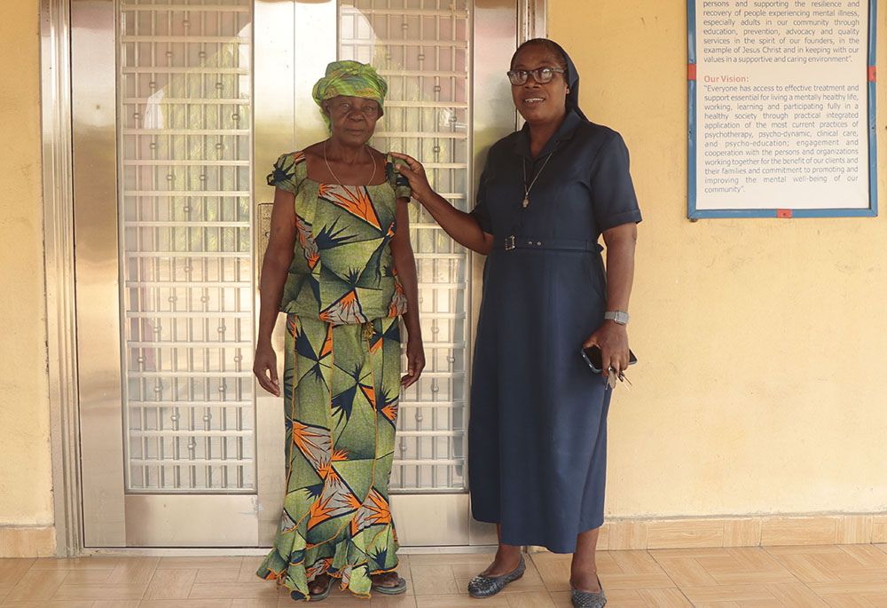 Sr. ElmaMary Ekewuba, Daughter of Charity of St. Vincent de Paul in Uyo, with one of her beneficiaries (Ayo Omotola)