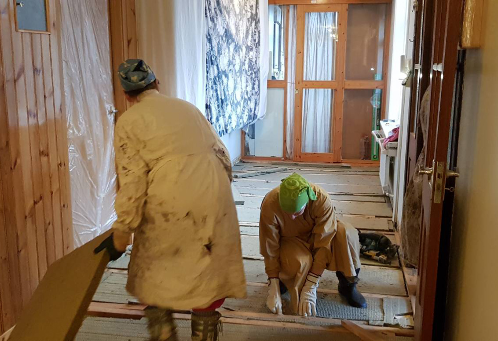 The Discalced Carmelite nuns of Hafnarfjordur, Iceland, work to replace the floor in the main corridor of the monastery. The old floor laid decades ago produced so much creaking that the loud noise was becoming a problem, which has been fixed. (Courtesy of Carmelite nuns of Hafnarfjordur)