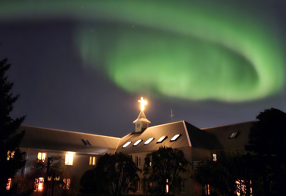 The northern lights appear over the Carmelite monastery located in Hafnarfjördur, Iceland. (Courtesy of Carmelite nuns of Hafnarfjordur)