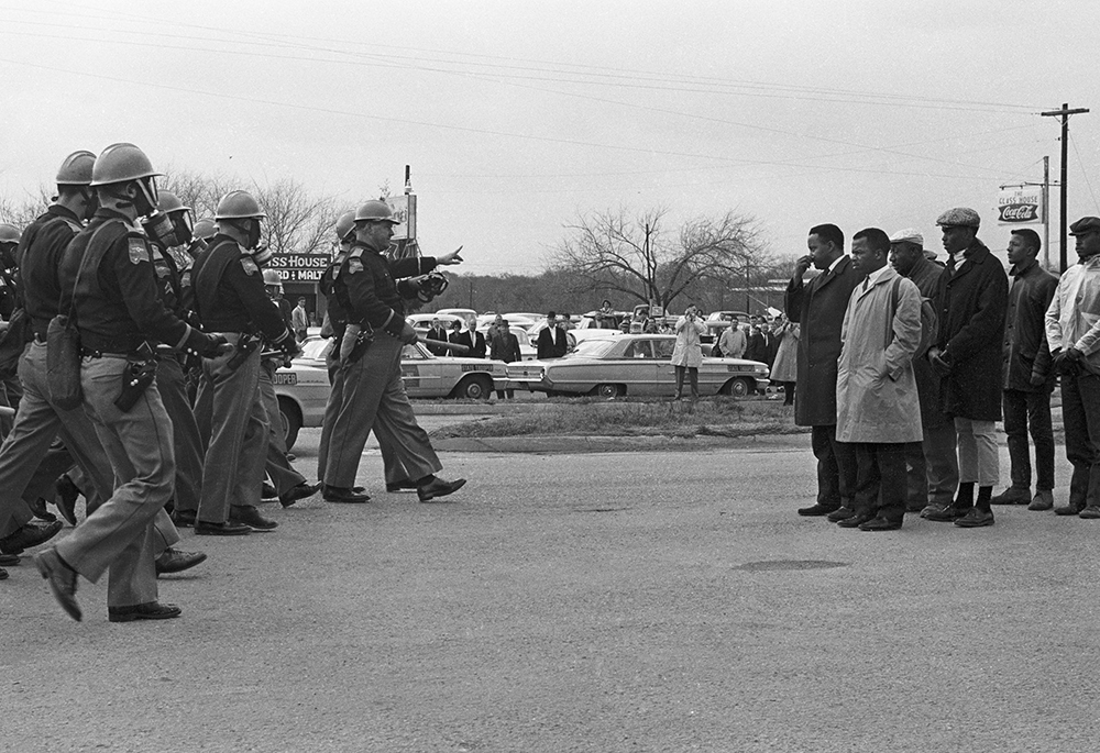 Protestors and police officers face off in Selma, Alabama, March 7, 1965, in what has come to be known by civil rights activists as Bloody Sunday. (OSV News/Courtesy of Magnolia Pictures)