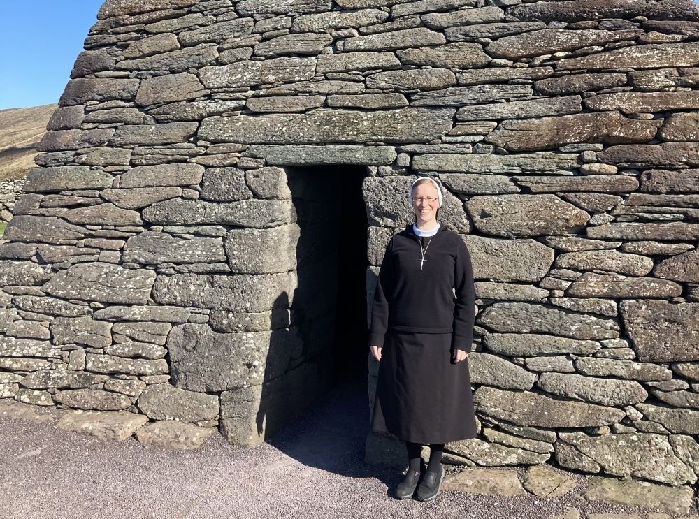 Sr. Kathryn Press stands in front of the Gallarus Oratory in Dingle Peninsula, Co. Kerry, Ireland, in March. 