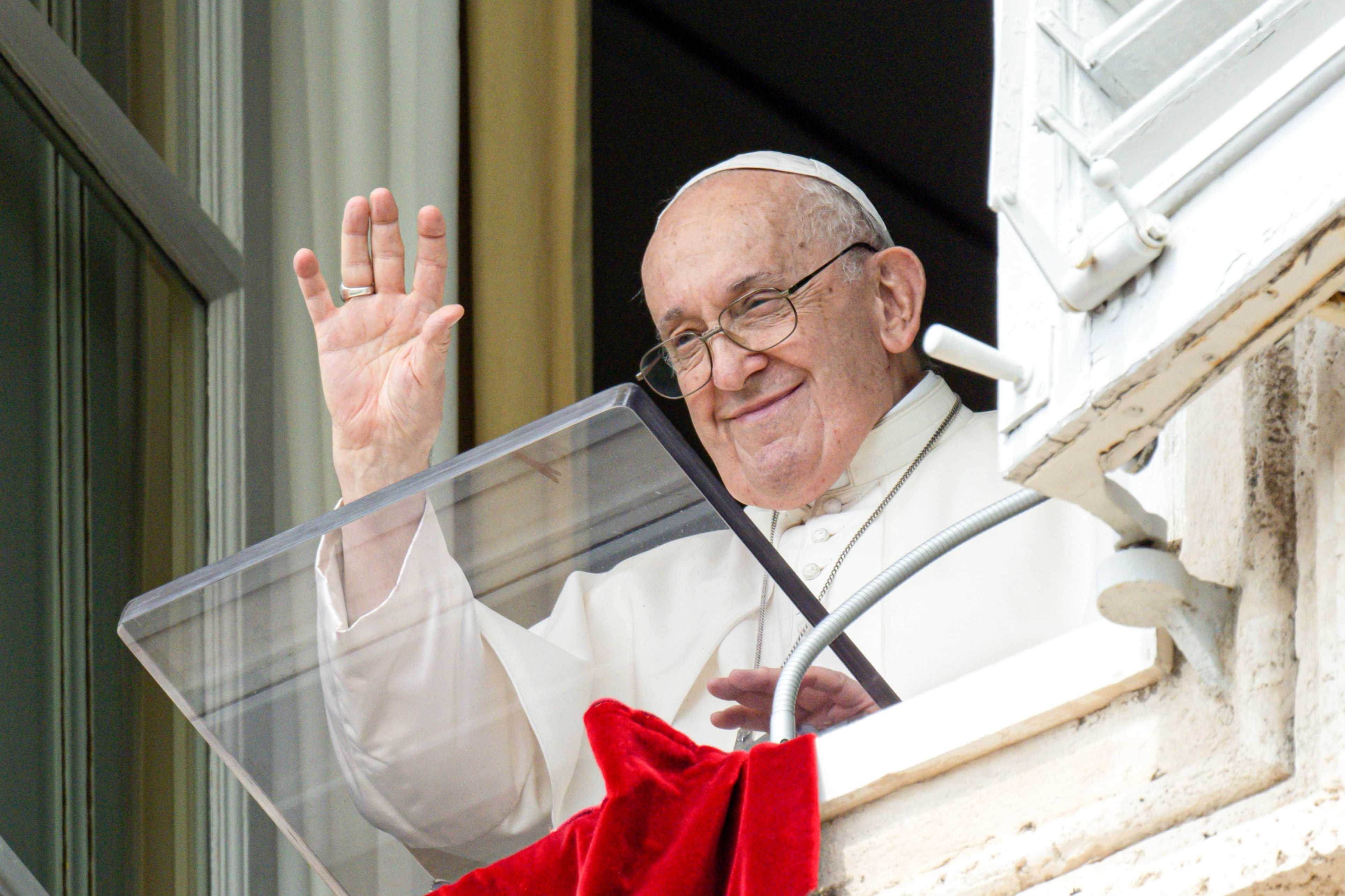 Pope Francis greets visitors gathered in St. Peter's Square at the Vatican to pray the Angelus on Aug. 27, 2023. (CNS/Vatican Media)