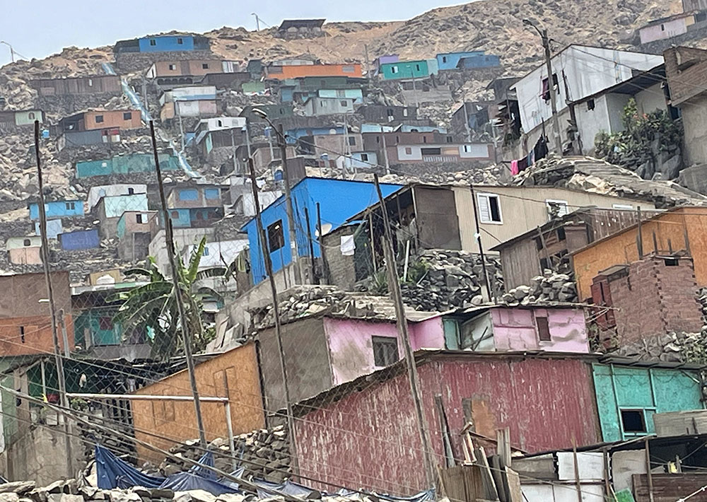 Houses along the slope in Lurigancho, Lima, Peru. There are many women leaders who work hard to serve the community. (Courtesy of Sophia Park)