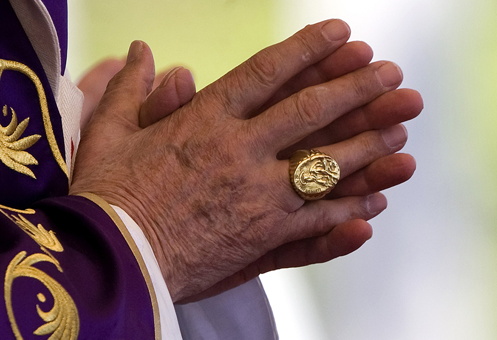 The fisherman's ring — the pope's signet — is seen on the right hand of Pope Benedict XVI as he celebrates Mass in Havana, Cuba, March 28, 2012. When a pope dies or resigns the ring is destroyed in a special ceremony, usually carried out in private. (CNS/Catholic Press Photo/Alessia Giuliani)