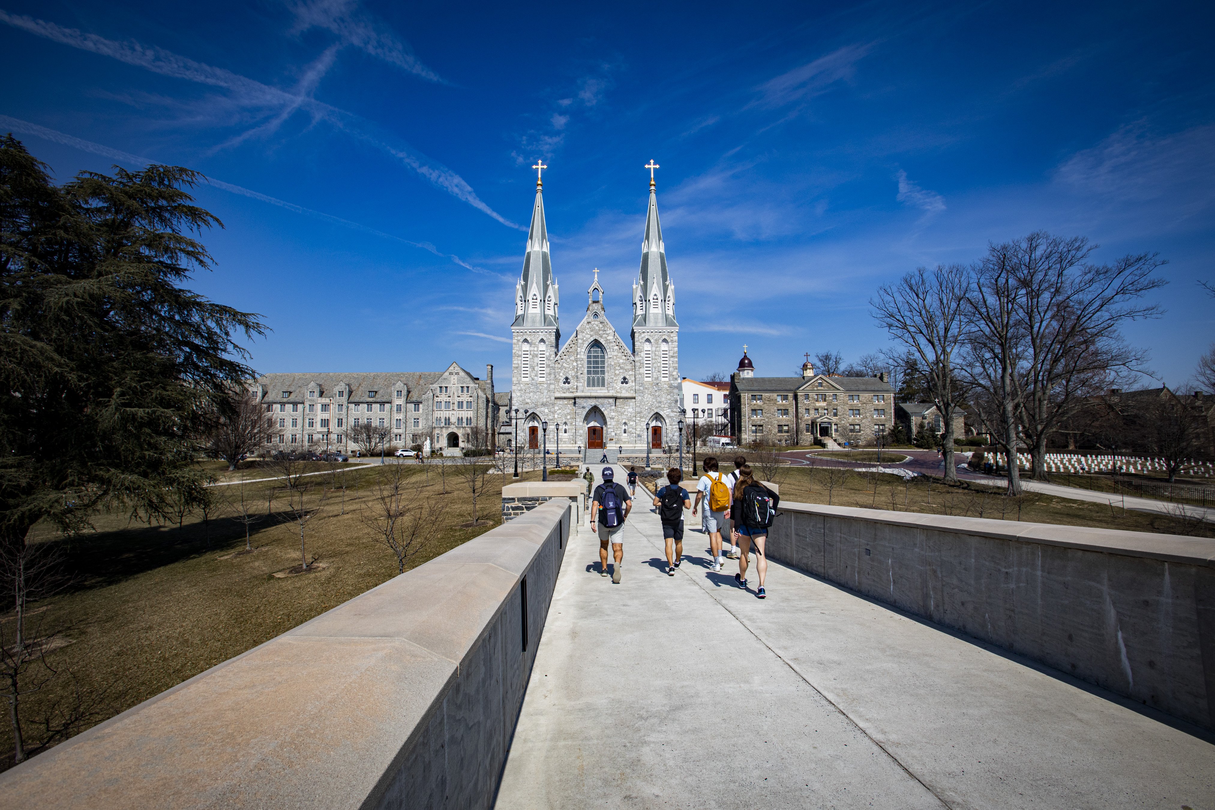 Students walk toward St. Thomas of Villanova Church on the campus of Villanova University near Philadelphia March 11, 2021. (CNS photo/Chaz Muth)