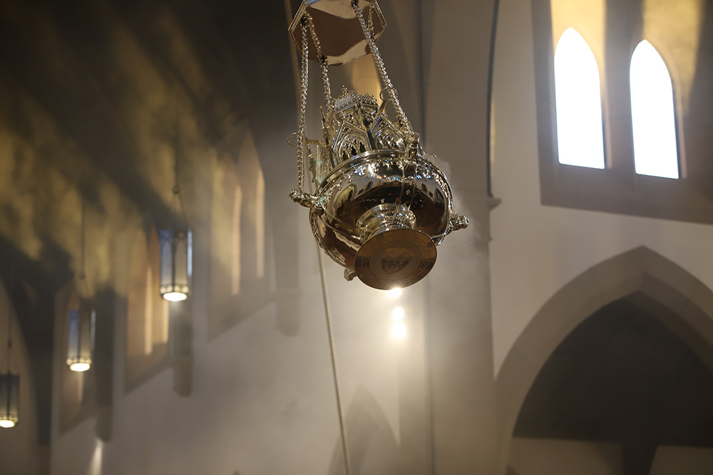 The botafumeiro swings as it is unveiled during vespers at Christendom College's Christ the King Chapel in Front Royal, Va., Nov. 24, 2024. The botafumeiro is a silver-plated brass censer with an eight-sided Gothic cathedral cupola perched atop its bowl, and is inspired by its namesake used at the cathedral in Santiago de Compostela, Spain, since the Middle Ages. (OSV News/Courtesy of Christendom College/Agnes Blum)