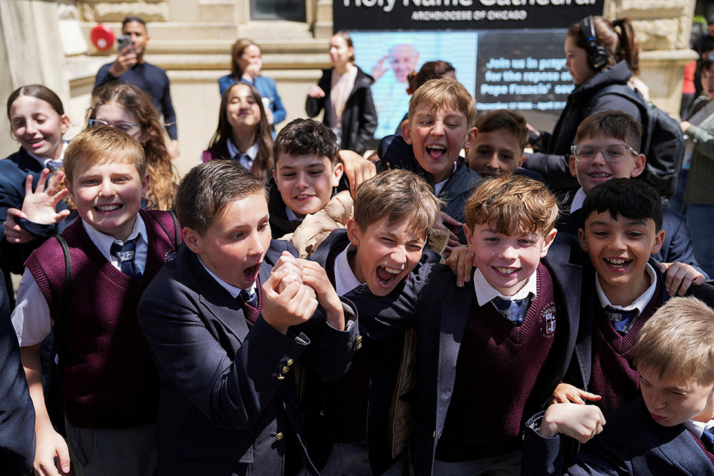 Students from Everest Academy in Lemont, Ill., cheer May 8, 2025, react after it was announced that Chicago-born Cardinal Robert Francis Prevost was elected as the next pope. (OSV News/Reuters/Vincent Alban)