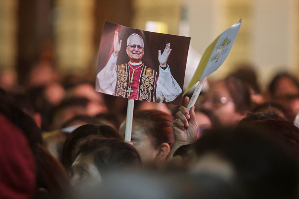 Someone holds a placard with an image of Pope Leo XIV on the day of a Mass at the Cathedral of Santa Maria de Chiclayo in Peru May 10, 2025, celebrating the election of Pope Leo XIV May 8 at the Vatican. The new pope was bishop of Chiclayo between 2015 and 2023. (OSV News/Reuters/Sebastian Castaneda)
