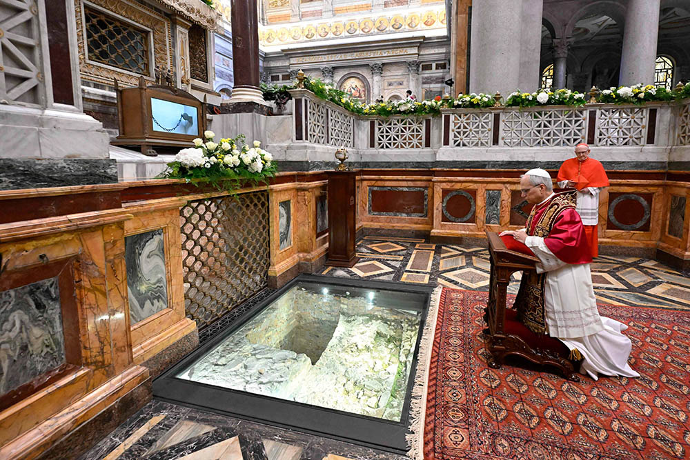Pope Leo XIV prays at the tomb of St. Paul at the Basilica of St. Paul Outside the Walls in Rome May 20, 2025. (CNS/Vatican Media)