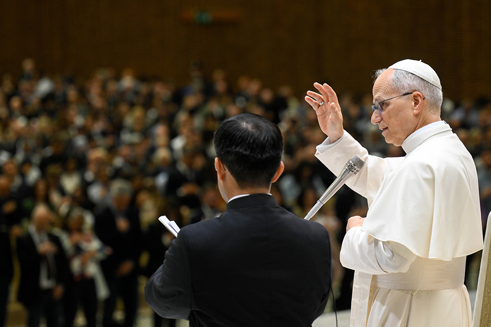 Pope Leo XIV gives his blessing to officials and employees of the Roman Curia, Vatican City State and the Rome Diocese during a meeting in the Paul VI Audience Hall at the Vatican May 24, 2025. (CNS/Vatican Media)
