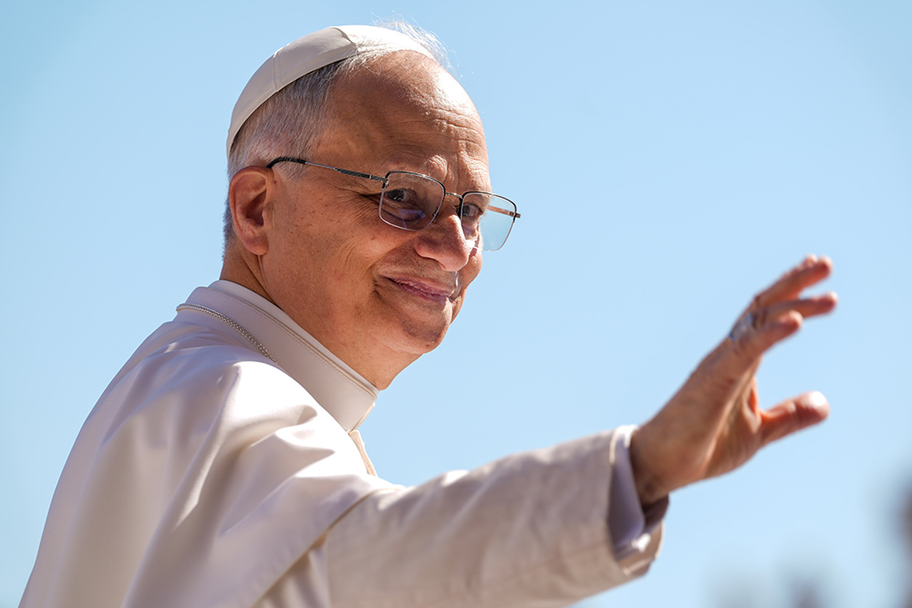 Pope Leo XIV waves as he rides the popemobile around St. Peter’s Square at the Vatican May 28, 2025, ahead of his second weekly general audience. (CNS/Lola Gomez)