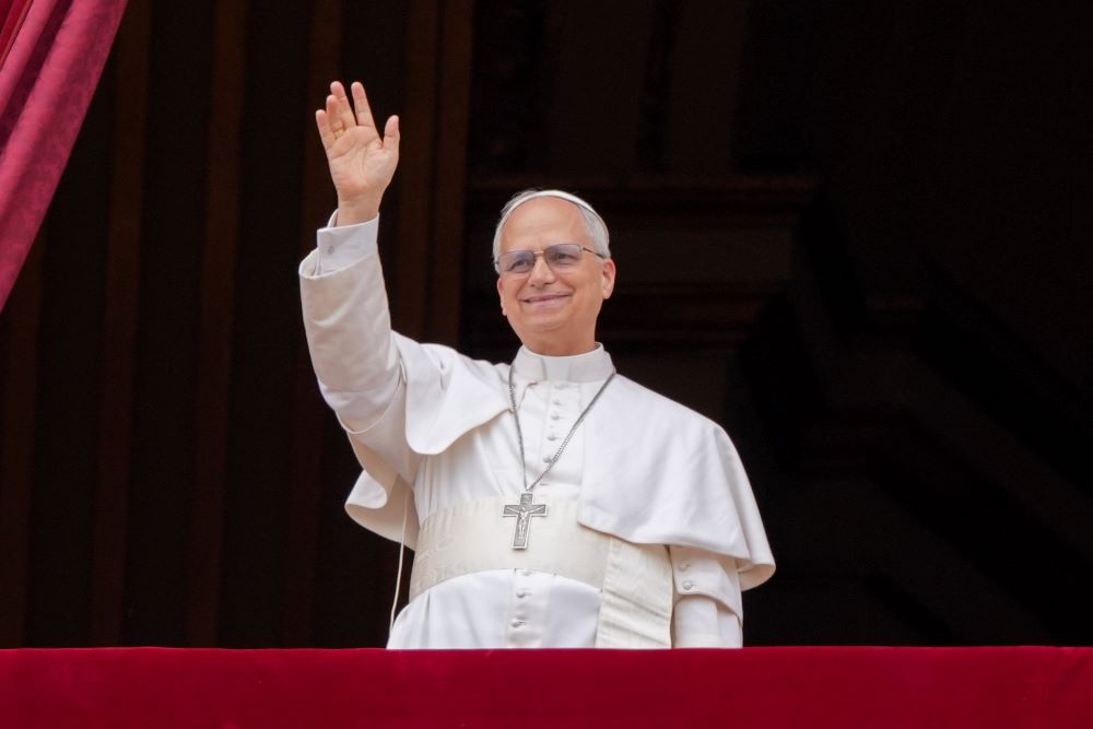 Pope Leo XIV waves to the crowd from the central balcony of St. Peter's Basilica at the Vatican as he leads, for the first time, the midday recitation of the "Regina Coeli" prayer May 11, 2025. (CNS/Lola Gomez)