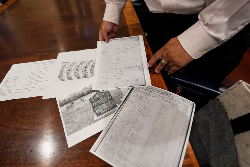 Jari Honora, family historian for the Historic New Orleans Collection, shows genealogy material related to the grandparents of Pope Leo XIV in New Orleans May 9. (AP/Gerald Herbert)
