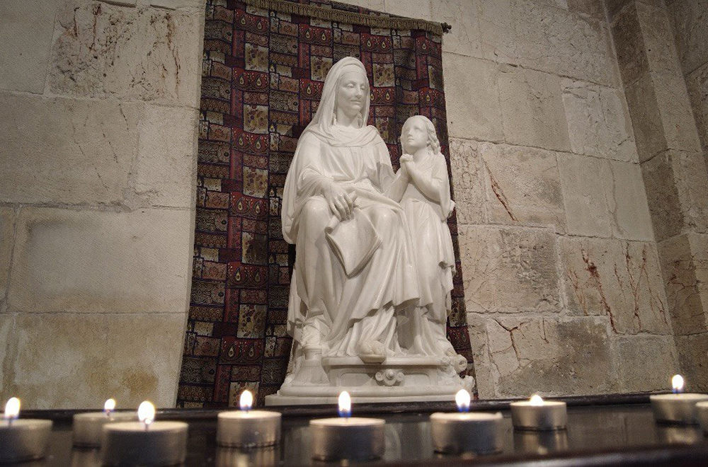 A sculpture of St. Anne with a young Virgin Mary is pictured at the Church of St. Anne in Jerusalem. St. Anne is believed to have been born at the site of the church. (Francesca Maria Lorenzini)