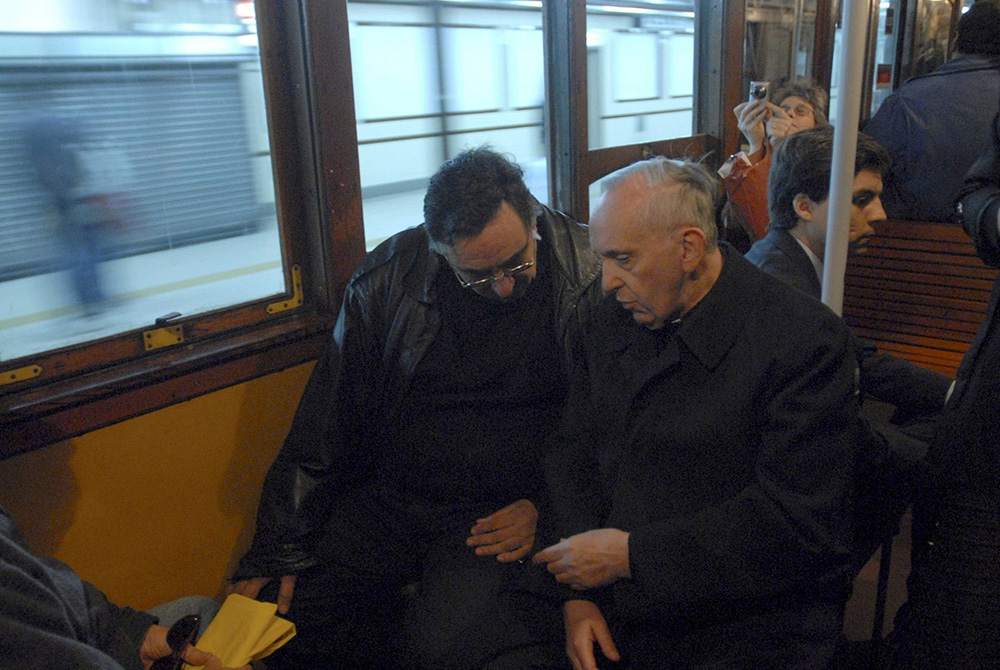Argentine Cardinal Jorge Mario Bergoglio, right, who later became Pope Francis, is pictured traveling by subway in Buenos Aires in 2008. (CNS/Diego Fernandez Otero, Clarin handout via Reuters)