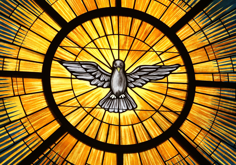 The Holy Spirit, traditionally depicted as a dove, is pictured in a stained-glass window at St. John Vianney Church in Lithia Springs, Georgia. The feast of Pentecost, marking the descent of the Holy Spirit upon the apostles, is May 24 this year. (CNS/Georgia Bulletin/Michael Alexander)