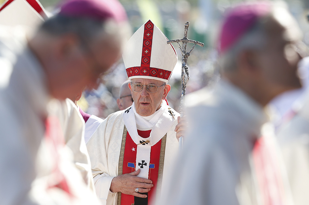 Pope Francis arrives in procession with other bishops during Mass at the Maquehue Airport near Temuco, Chile, Jan. 17, 2018. (CNS/Paul Haring)