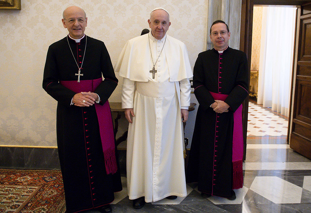 Pope Francis is pictured with Msgr. Fernando Ocáriz, left, the head of Opus Dei, and Msgr. Mariano Fazio, the auxiliary vicar of the prelature, during an audience at the Vatican Nov. 29, 2021. (CNS/Vatican Media)