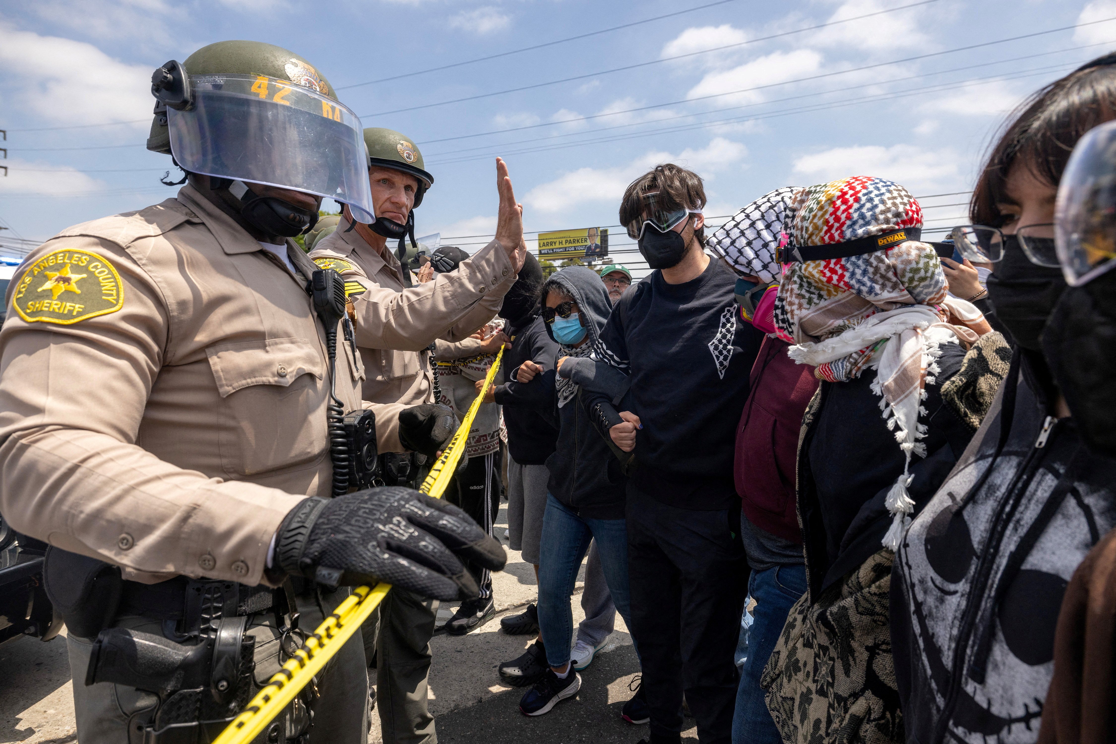 Los Angeles County Sheriff's deputies maintain a cordon following multiple detentions by Immigration and Customs Enforcement in Compton, Calif., June 7, 2025. (OSV News/Reuters/Barbara Davidson)