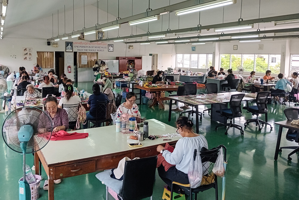 A group of women artisans work at the Fatima Self-Help Centre in Bangkok, where women and girls break the cycle of poverty through skills training, such as sewing and dressmaking. (Courtesy of Louise Horgan)