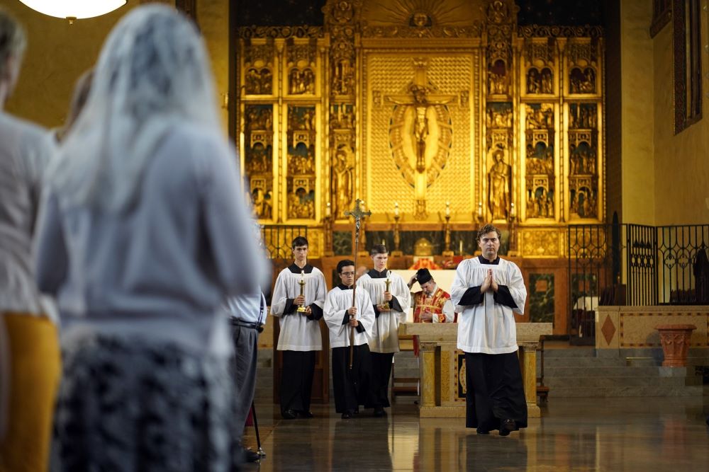 Altar servers lead the closing procession during a traditional Latin Mass at Immaculate Conception Seminary in Huntington, N.Y., July 1, 2021. 