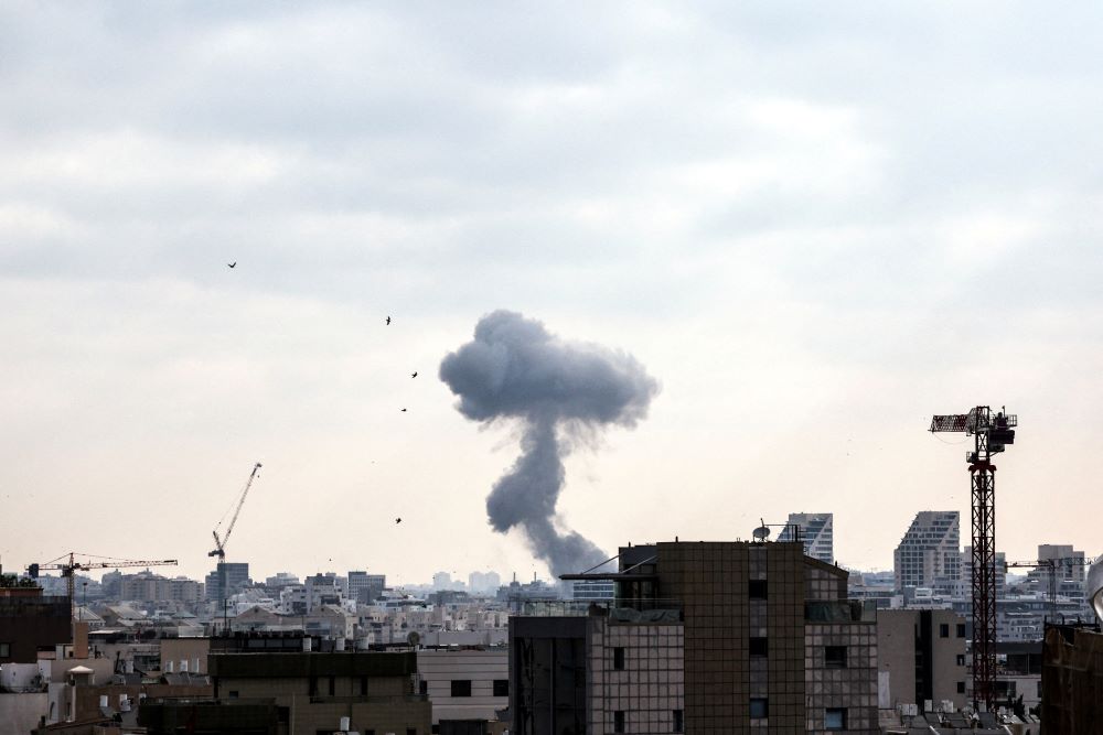 Smoke during a missile attack from Iran on Israel, amid the Iran-Israel conflict, in Tel Aviv, Israel, June 22. (OSV News/Reuters/Violeta Santos Moura)