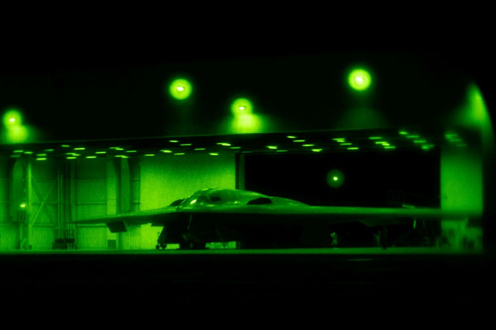 A U.S. Air Force B-2 Spirit stealth bomber is prepared for operations before Operation Midnight Hammer, the U.S. attack on Iran's nuclear facilities, at Whiteman Air Force Base, Mo., June 2025, in a photograph taken using night vision optics. (OSV/U.S. Air Force/Handout via Reuters)